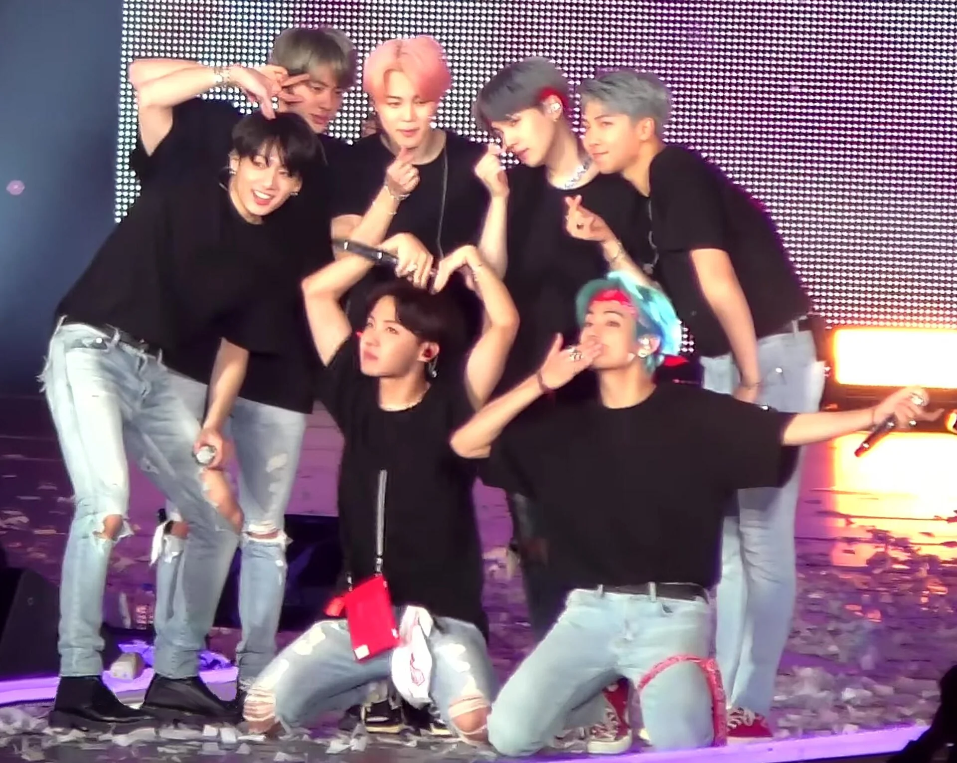 The seven members of BTS together onstage at the end of a concert in Nagoya in January 2019