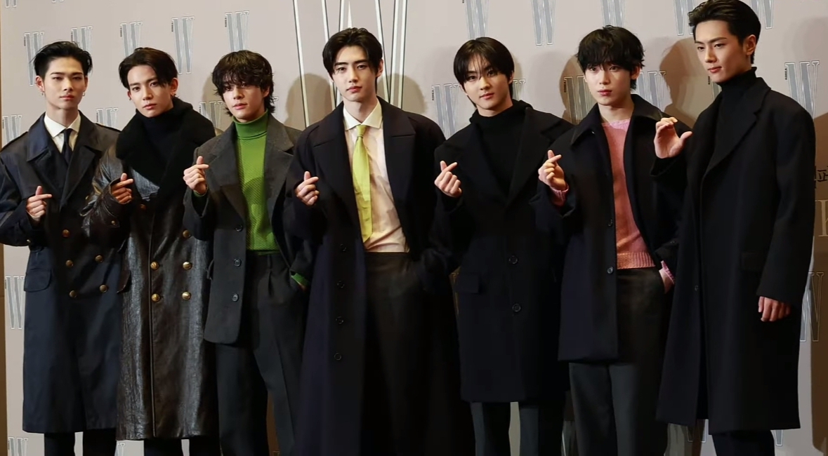 ENHYPEN photographed as seven members in October 2024, before the 2026 lineup change