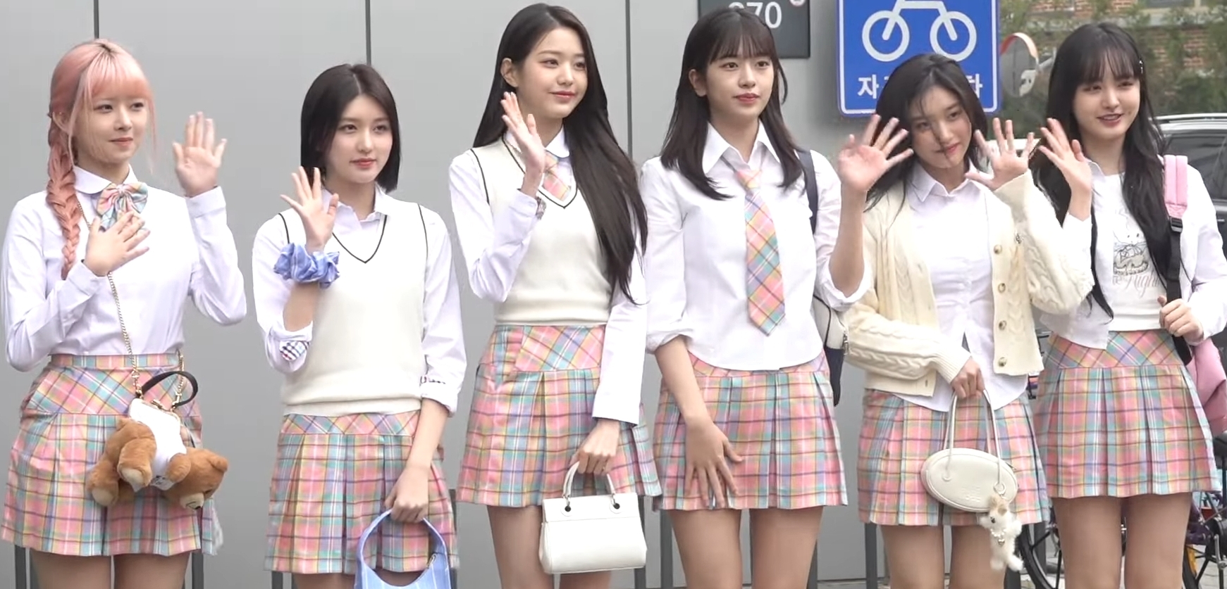 All six IVE members arriving for a television recording in 2023