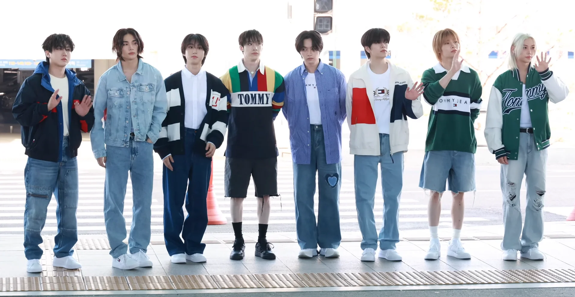 All eight members of Stray Kids standing together at Incheon Airport in May 2024